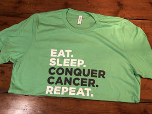 Eat. Sleep. Conquer Cancer. Repeat. Tee (Green)